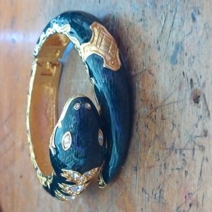 Joan Rivers snake bracelet